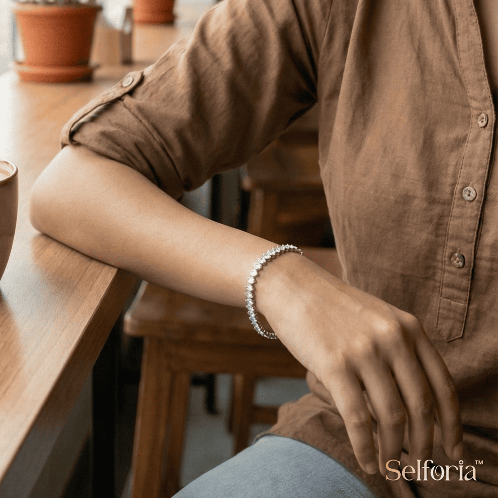 Woman wearing a silver stone tennis bracelet styled for office wear and casual looks