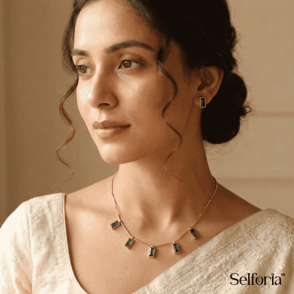 Woman wearing emerald green drop necklace for daily wear, minimal and elegant look