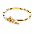 A Selforia Gold Nail hinged cuff bracelet with a polished finish and small clear stones set along the front prong, shown on a clean white background.