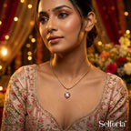 Heart shaped pink pendant necklace styled with ethnic wear, gold jewellery for festive occasions