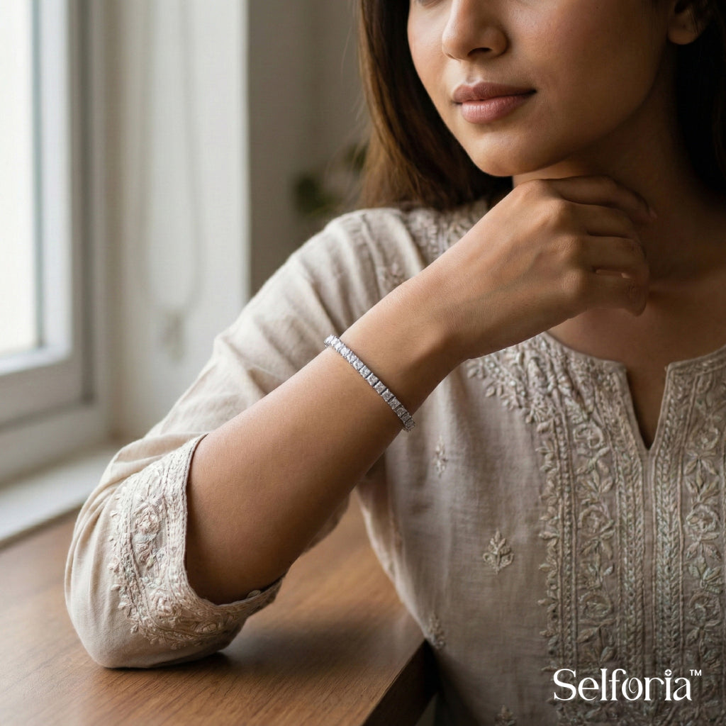 Woman wearing a silver stone tennis bracelet, elegant and lightweight jewellery for daily wear