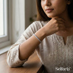 Woman wearing a silver stone tennis bracelet, elegant and lightweight jewellery for daily wear