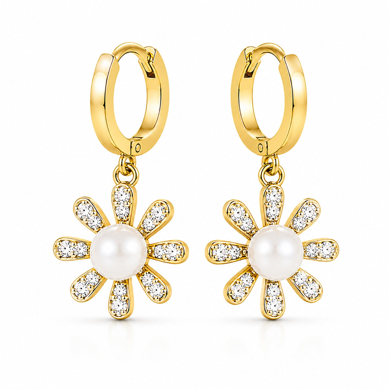A pair of gold hoop earrings with dangling flower charms. Each flower charm features a central white pearl surrounded by clear pavé-set stones in a gold frame, shown on a clean white background.