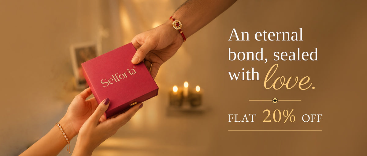 A promotional banner showing a person's hands receiving a magenta-pink jewelry box branded 'Selfotta' from another person's hand, set against a warm, candle-lit background. To the right, text reads 'An eternal bond, sealed with love.