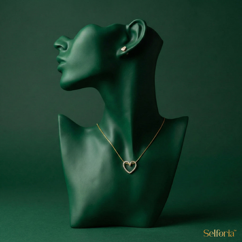 Mannequin displaying heart-shaped gold-plated necklace