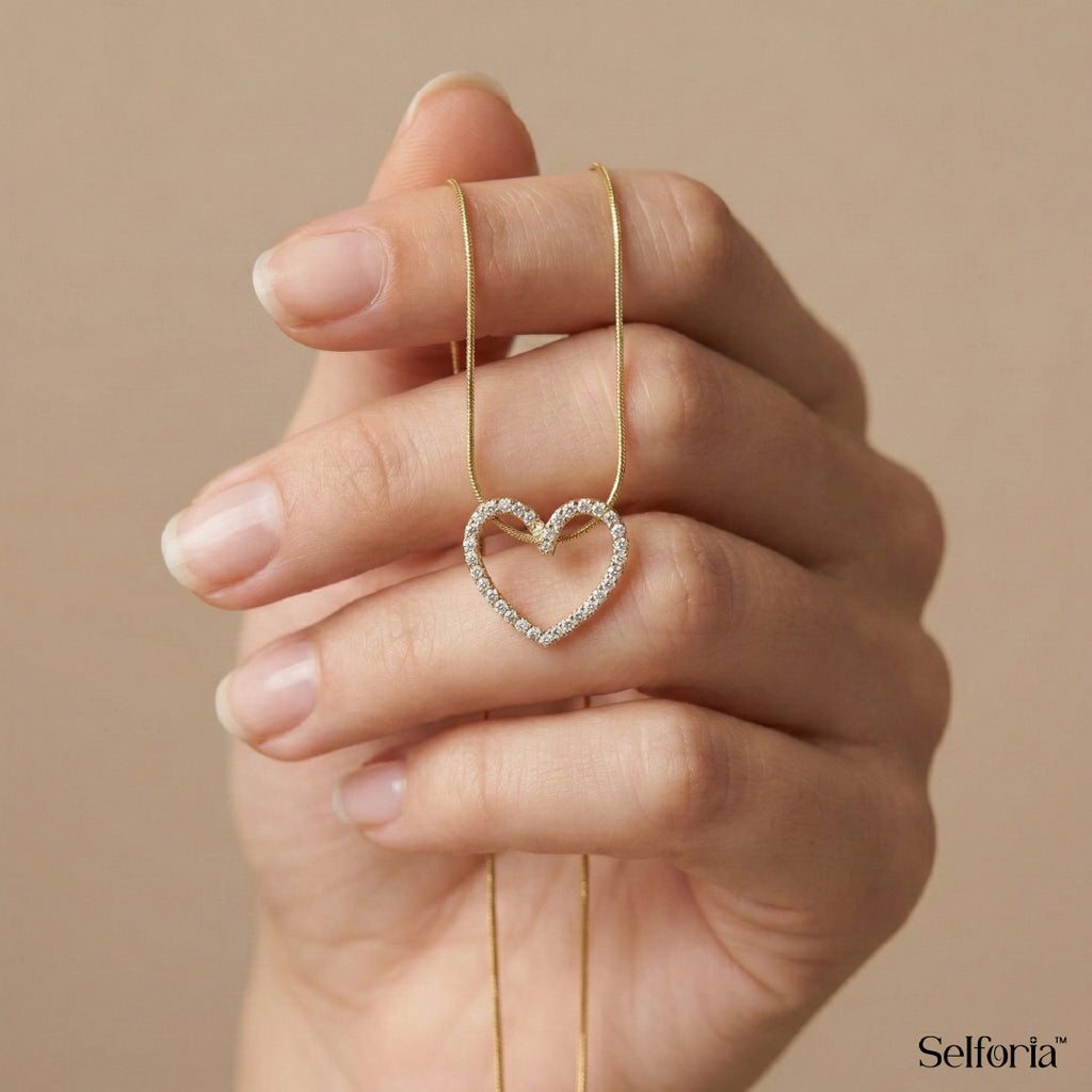 Close-up shot of heart pendant necklace in gold finish